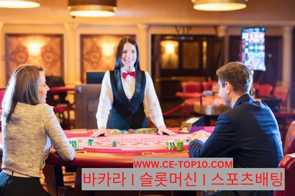 Casino dealer standing infront of two gamblers playing at casino 