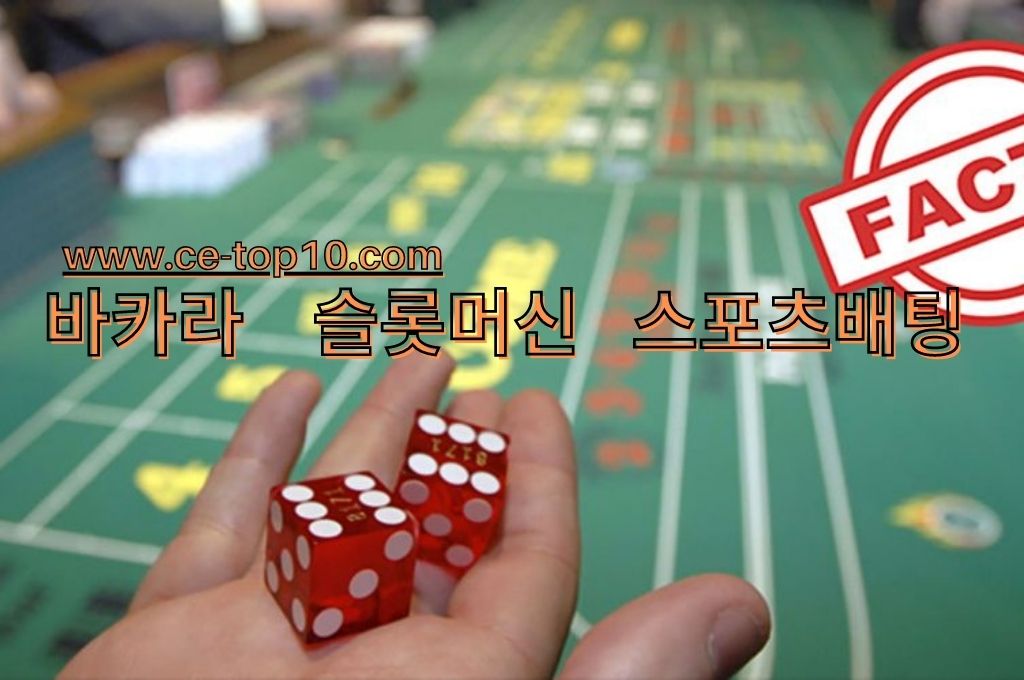 Open palm  with two red dice on top, FACT warning and casino table 